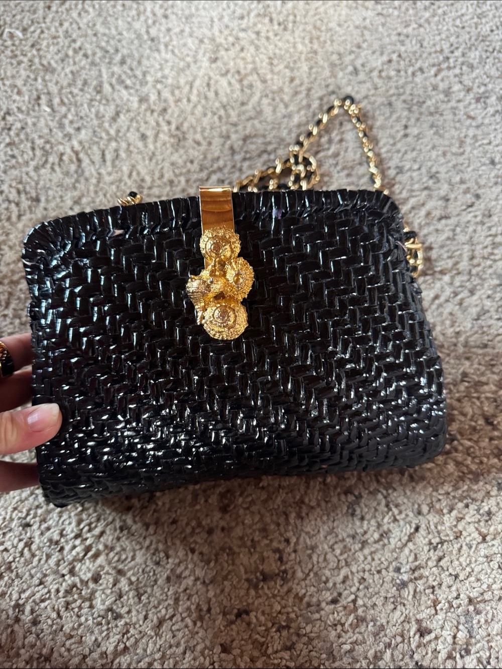 Black Woven Shoulder Bag with Gold Chain and Floral Accent